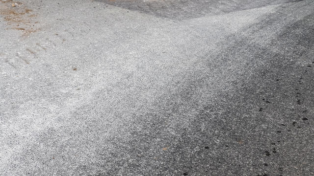 Detailed view on asphalt surfaces of different streets and roads with cracks 