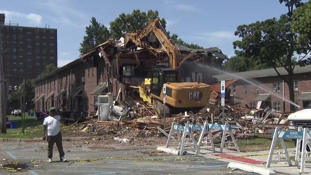 Construction equipment is used to tear down a Newark apartment building after an explosion. 