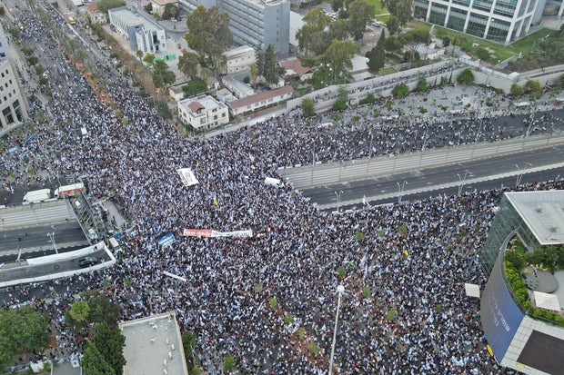 An aerial view shows right-wing demonstrators backing the Israeli government and its reform plans rallying in Tel Aviv, the epicenter of 29 straight weeks of anti-government protests, on July 23, 2023.