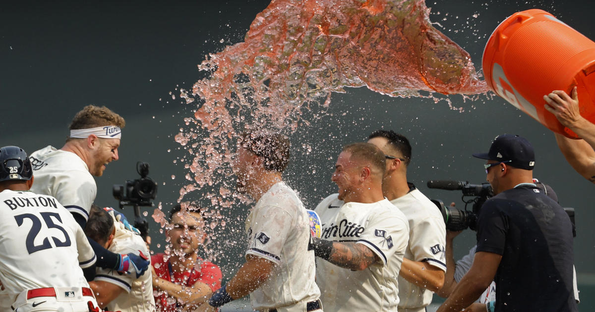 Minnesota Twins' Alex Kirilloff walks to the dugout after being