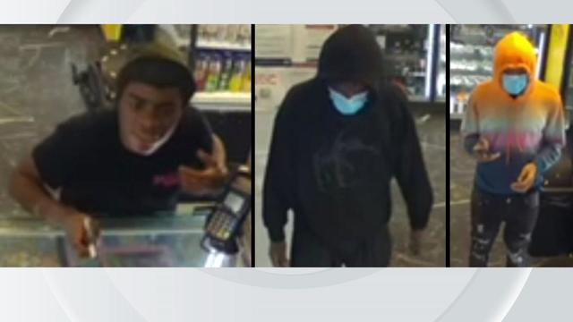 Surveillance photos of three people wanted in an armed robbery in Queens. 
