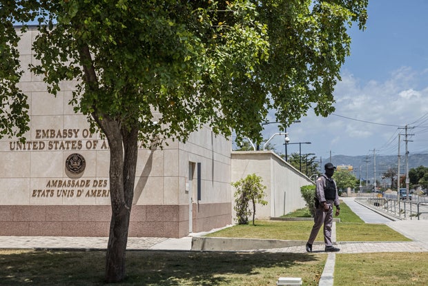 Security awaits the arrival of an unidentified Haitian diplomatic delegation at the U.S. Embassy in Port-au-Prince July 11, 2021, three days after the assassination of Haitian leader Jovenel Moise.