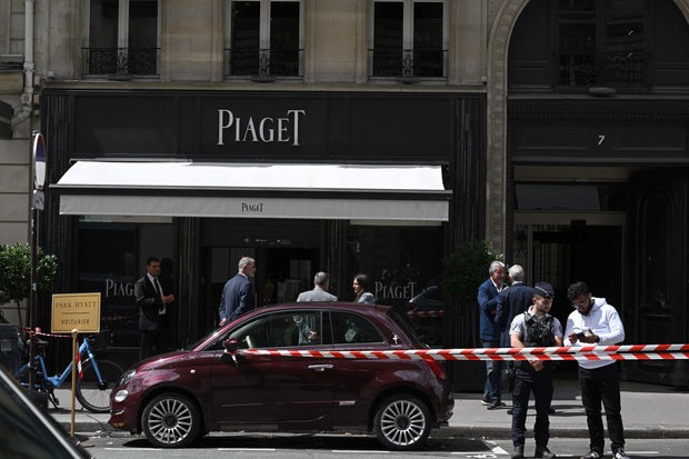 Red and white police tape cordons off the entrance of the French luxury Piaget jewelers store at Rue de la Paix that leads to Place Vendome, in Paris on August 1, 2023.