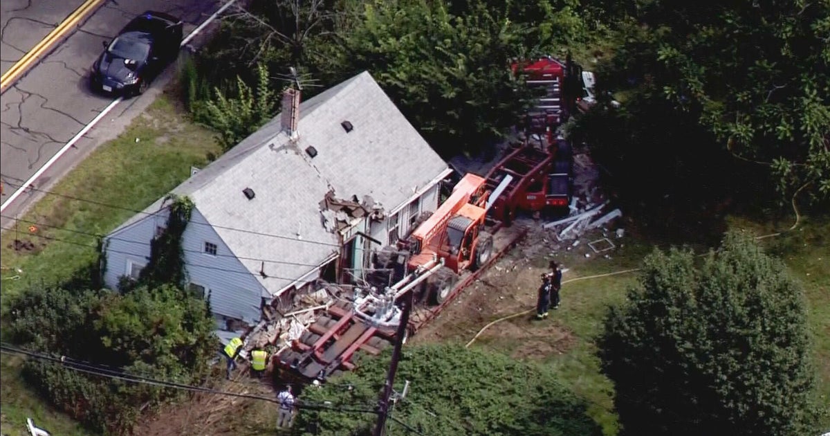 Bellingham home destroyed in tractortrailer crash, driver critically