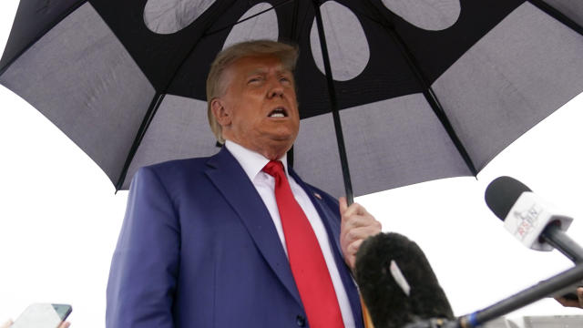 Former President Donald Trump speaks before he boards his plane at Ronald Reagan Washington National Airport on Thursday, Aug. 3, 2023, in Arlington, Virginia. 