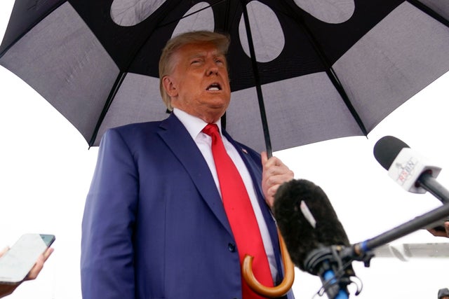 Former President Donald Trump speaks before he boards his plane at Ronald Reagan Washington National Airport on Thursday, Aug. 3, 2023, in Arlington, Virginia. 