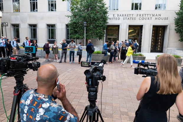Journalists line up to enter the E. Barrett Prettyman Courthouse on Aug. 3, 2023, in Washington, D.C.