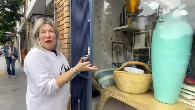 Oakland store owner showing security gates 
