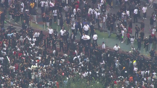 An aerial view of a line of NYPD officers as thousands of people crowded into Union Square.