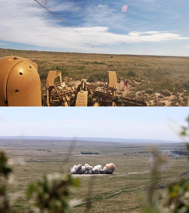 A Mine Clearing Line Charge (MICLIC) is launched into a minefield, and then detonated