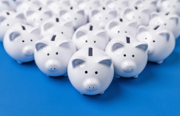 Little white piggy banks close up