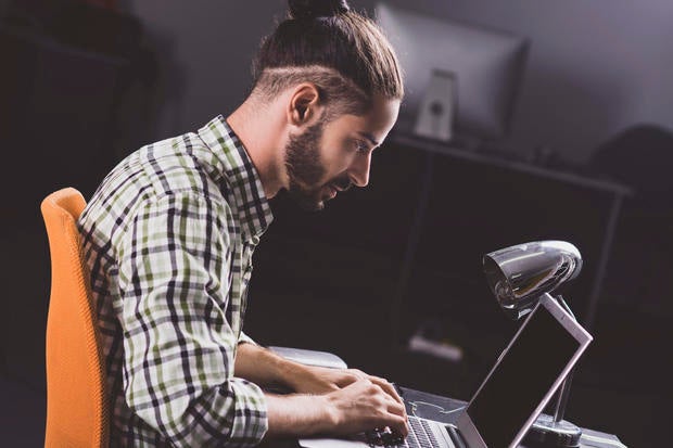 Man using laptop in office 