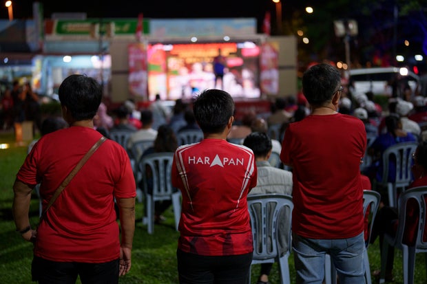Supporters of Harapan-BN coalition attend an election campaign ahead of the state election in Sepang, Selangor state in Malaysia Tuesday, Aug. 8, 2023