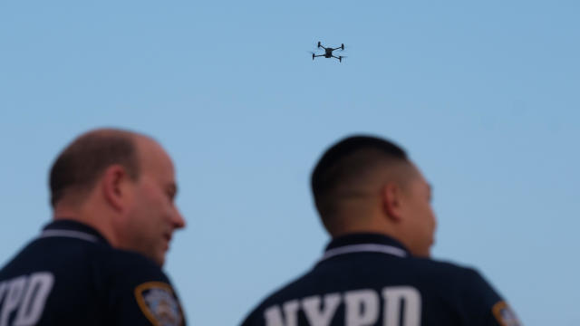 Police deploy a drone to search the water at Rockaway Beach at Beach 59th Street in Queens, New York City after a swimmer was bitten by a shark on Monday, August 7, 2023. 