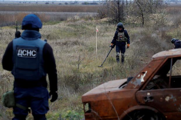 FILE PHOTO: Ukrainian mine experts scan for unexploded ordnance and landmines Kherson region 