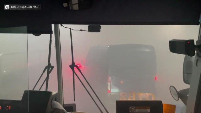 A photo taken from inside a bus shows smoke clouding the Lincoln Tunnel. 