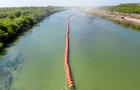Texas Deploys Buoys Into Rio Grande River To Deter Migrants 