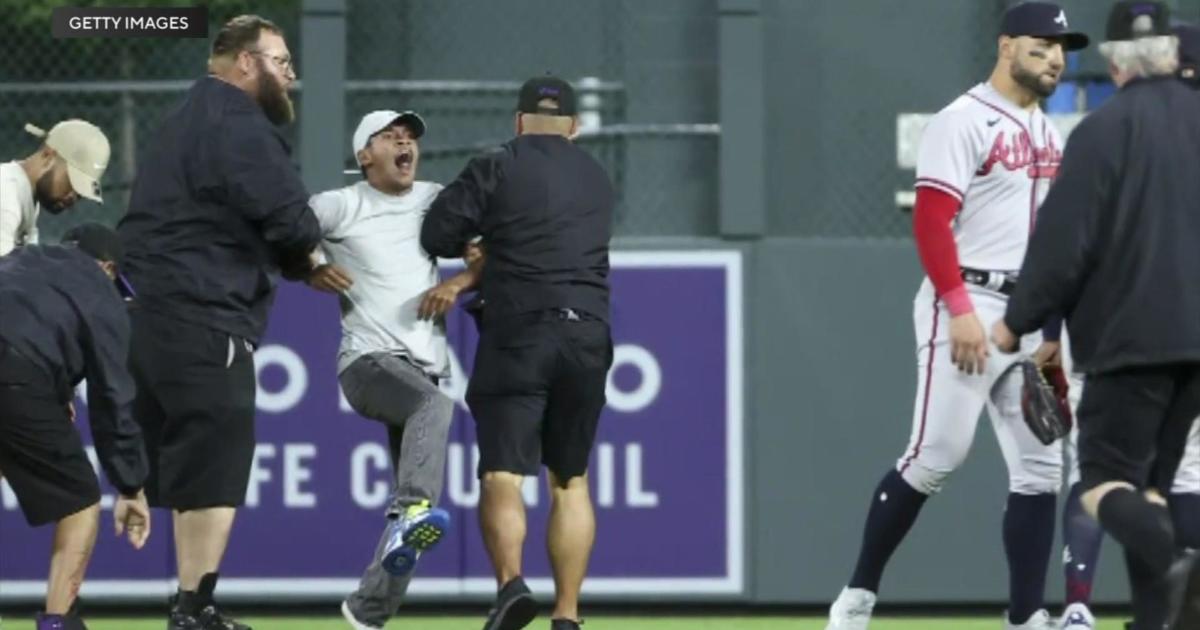 Fan who tackled Rockies mascot 'Dinger' during game turns himself