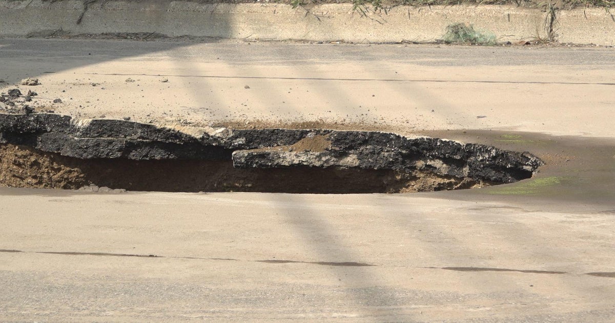 Sinkhole forces closure on Wixom Road; traffic, school bus routes ...