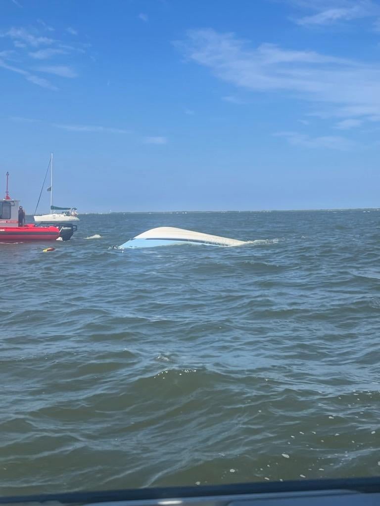 Boat capsizes "moments after" Coast Guard rescues 4 people and dog in ...