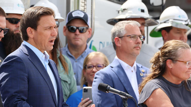 Florida Gov. Ron DeSantis speaks among Duke Energy electrical line technicians during a press conference at Duke Energy's Operations Center in Wildwood, Florida on Tuesday, Aug. 29, 2023. 