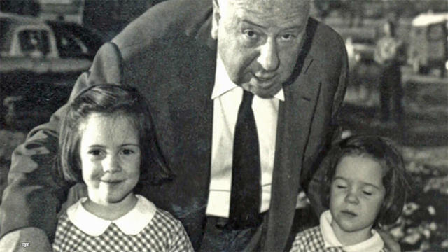Alfred Hitchock Poses with His Granddaughters 