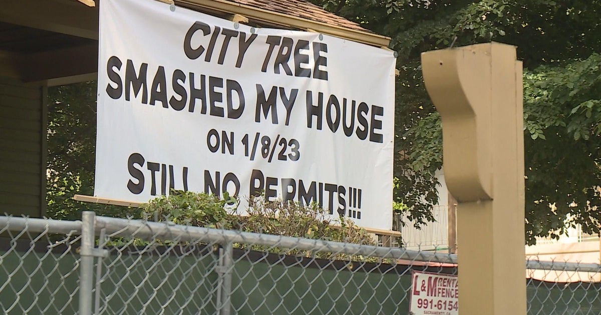Midtown Sacramento homeowner wins permit plea after hanging bold banner outside storm-damaged home