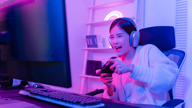 Girl in gaming chair playing a game 