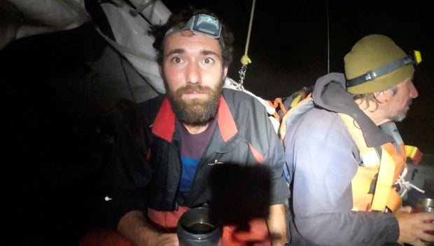Sailors Stanislav Berezkin and Vincent Thomas Etienne, whose inflatable catamaran was attacked by sharks and began sinking in the Coral Sea, are seen in this screengrab taken from a handout video, September 5, 2023