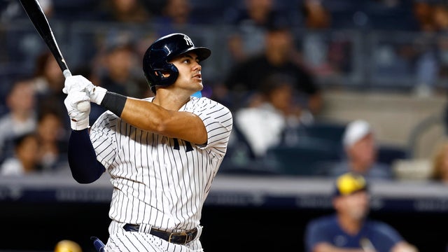 Jasson Dominguez #89 of the New York Yankees hits a two-run home run against the Milwaukee Brewers during the third inning of a game at Yankee Stadium on September 8, 2023 in New York City. 