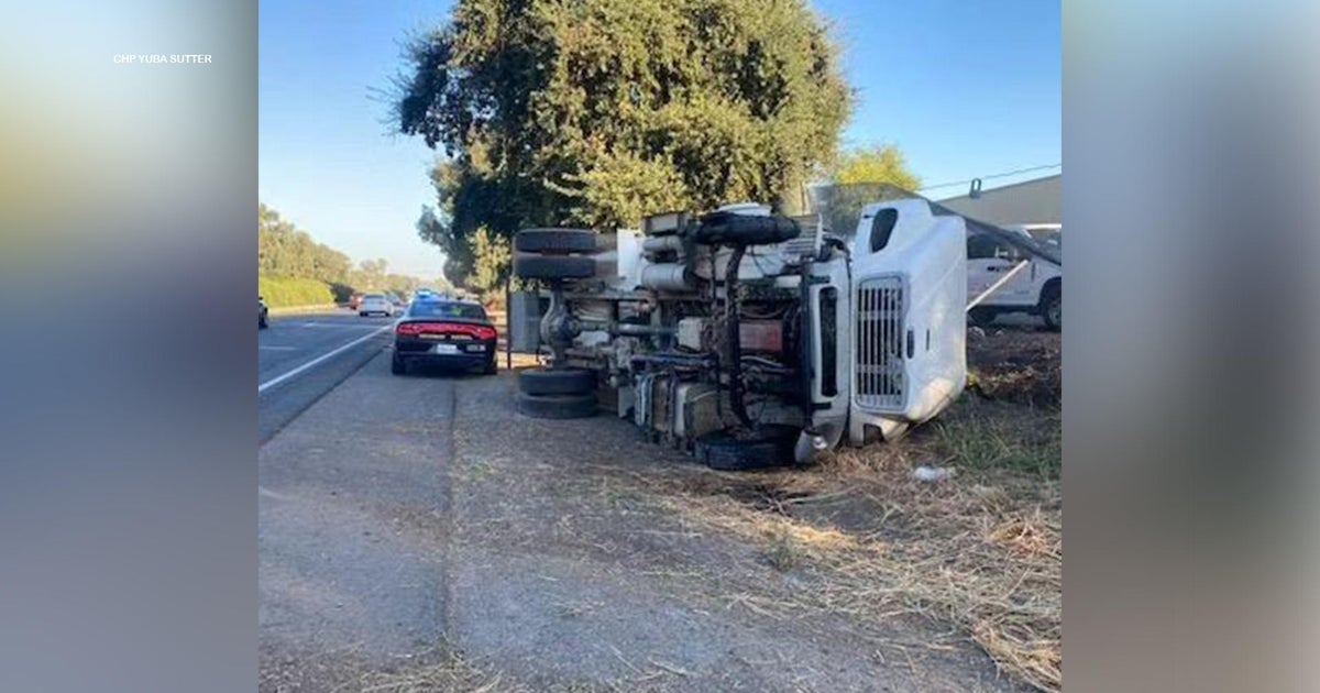 Truck blows tire, comes dangerously close to hitting CHP officer on the side of the road