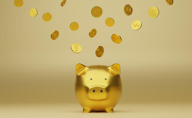 Golden piggy bank and golden coins, 3d render 