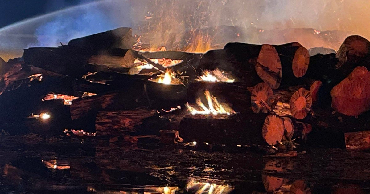 Large pile of wood burning in Oroville
