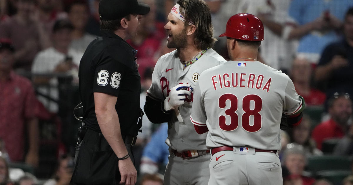 Harper walks twice in Phils debut, draws cheers and 4-man OF