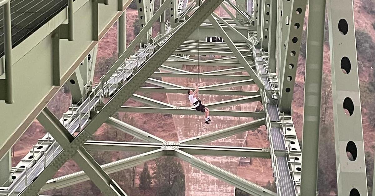 Teen rescued after getting stuck dangling 700 feet above river on California's tallest bridge