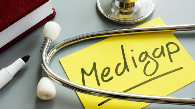 Medigap or medicare supplement insurance inscription and stethoscope. 