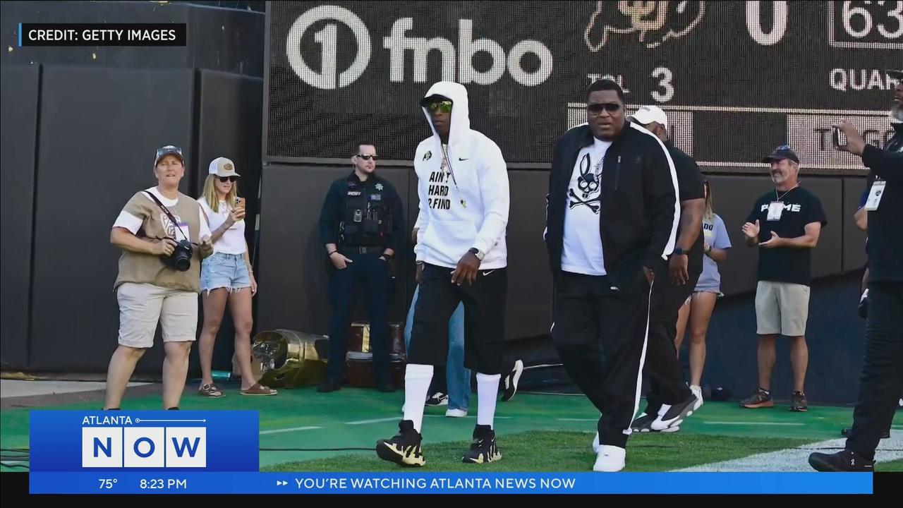 Atlanta Falcons Deion Sanders during practice before leaving for