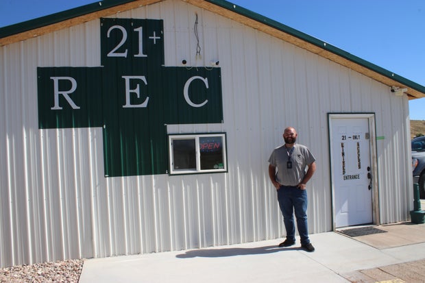 Lando Blakley stands outside his retail marijuana store in Colorado