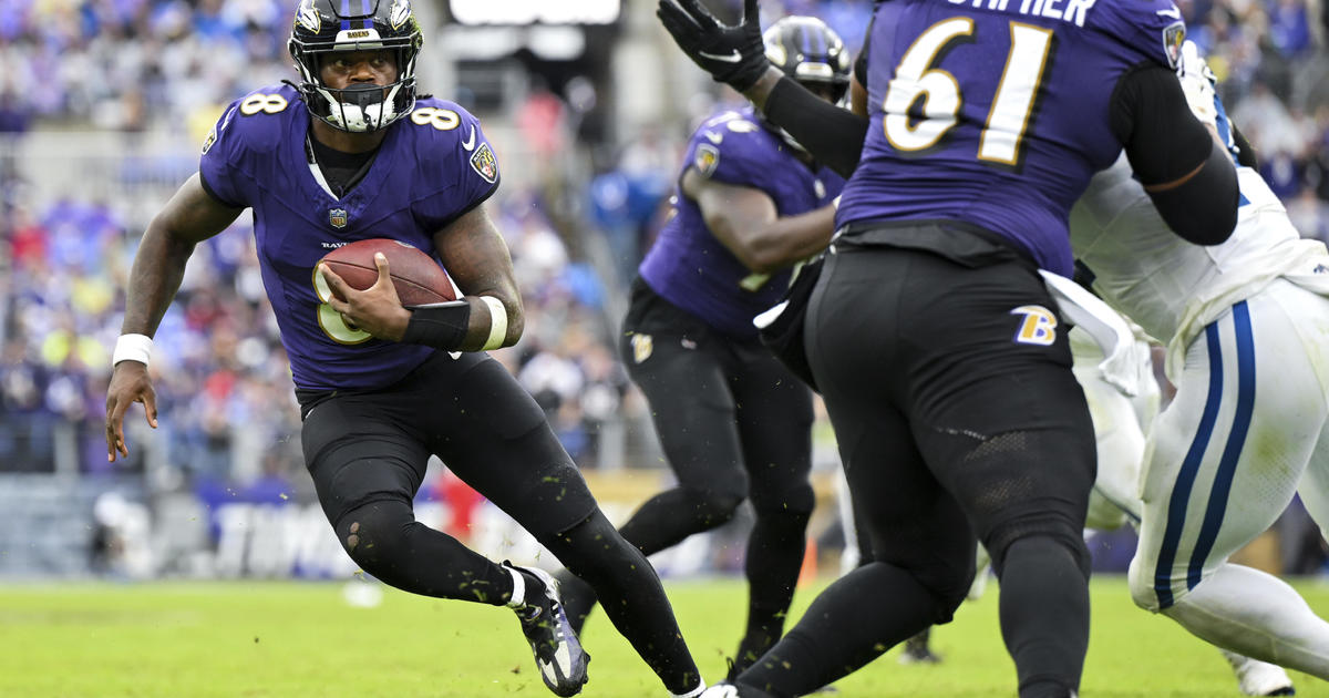 Baltimore Ravens' Justin Tucker (9) slips after a field goal