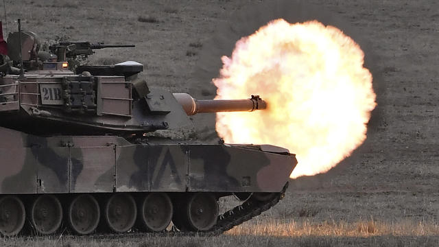 An Australian army M1A1 Abrams main battle tank fires a round at a target during a live fire demonstration at the Puckapunyal Military Base north of Melbourne on May 9, 2019. 