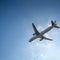 Directly Below Shot Of Airplane Flying In Sky 