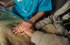 Nurse holding patient's hand 