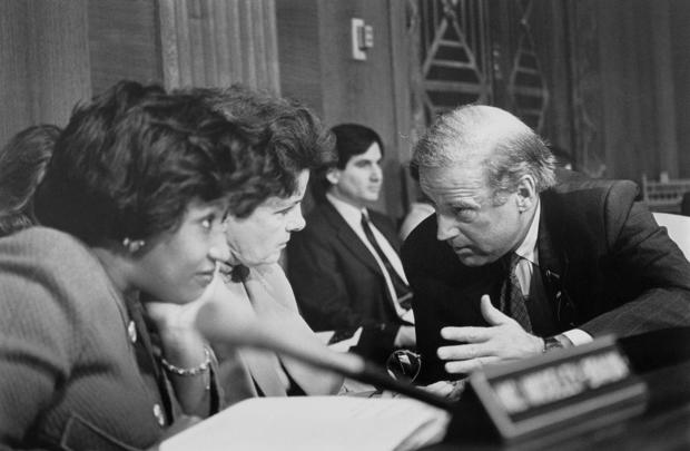 Democratic Sen. Carol Moseley Braun of Illinois, Dianne Feinstein of California and Joe Biden of Delaware speak during a Senate hearing on Nov. 13, 1993. 