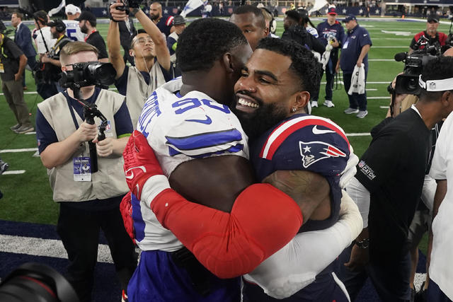 New England Patriots running back Ezekiel Elliott (15) hugs