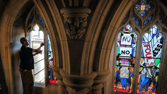The National Cathedral installs stained glass windows dedicated to racial justice to replace the original confederate themed display on August 22 in Washington, DC. 