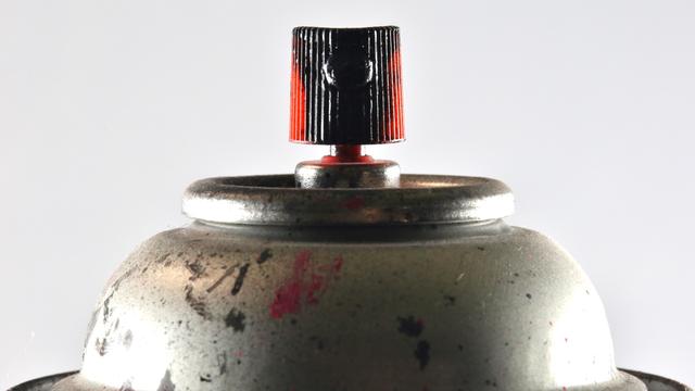 Aerosol spray can with paint splatter 