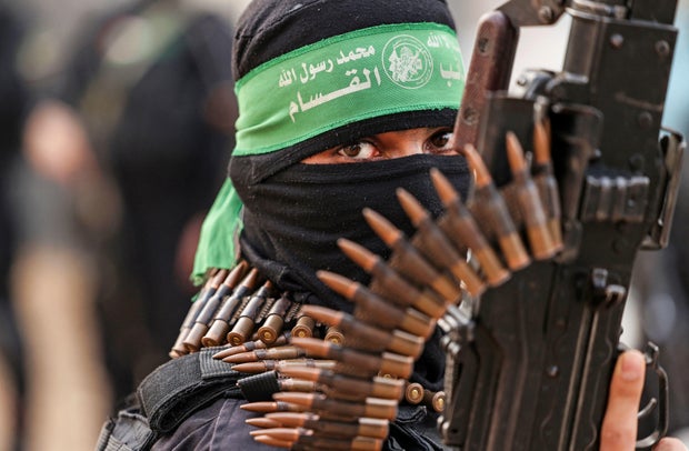 A member of the al-Qassam Brigades, the military wing of the Palestinian Hamas movement, takes part in a parade in Gaza City on November 14, 2021.