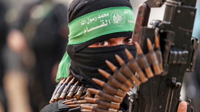 A member of the al-Qassam Brigades, the military wing of the Palestinian Hamas movement, takes part in a parade in Gaza City on November 14, 2021. 