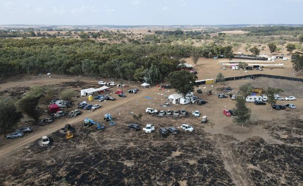 An aerial picture shows the site of the attack on a music festival by Hamas militants near kibbutz Re'im in the Negev desert in southern Israel on October 10, 2023. 