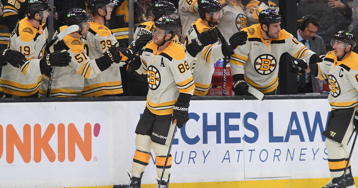 Boston Bruins left wing Brad Marchand (63) wears a green jersey as part of  the team's Salute to Service to honor members of the military while warming  up prior to an NHL